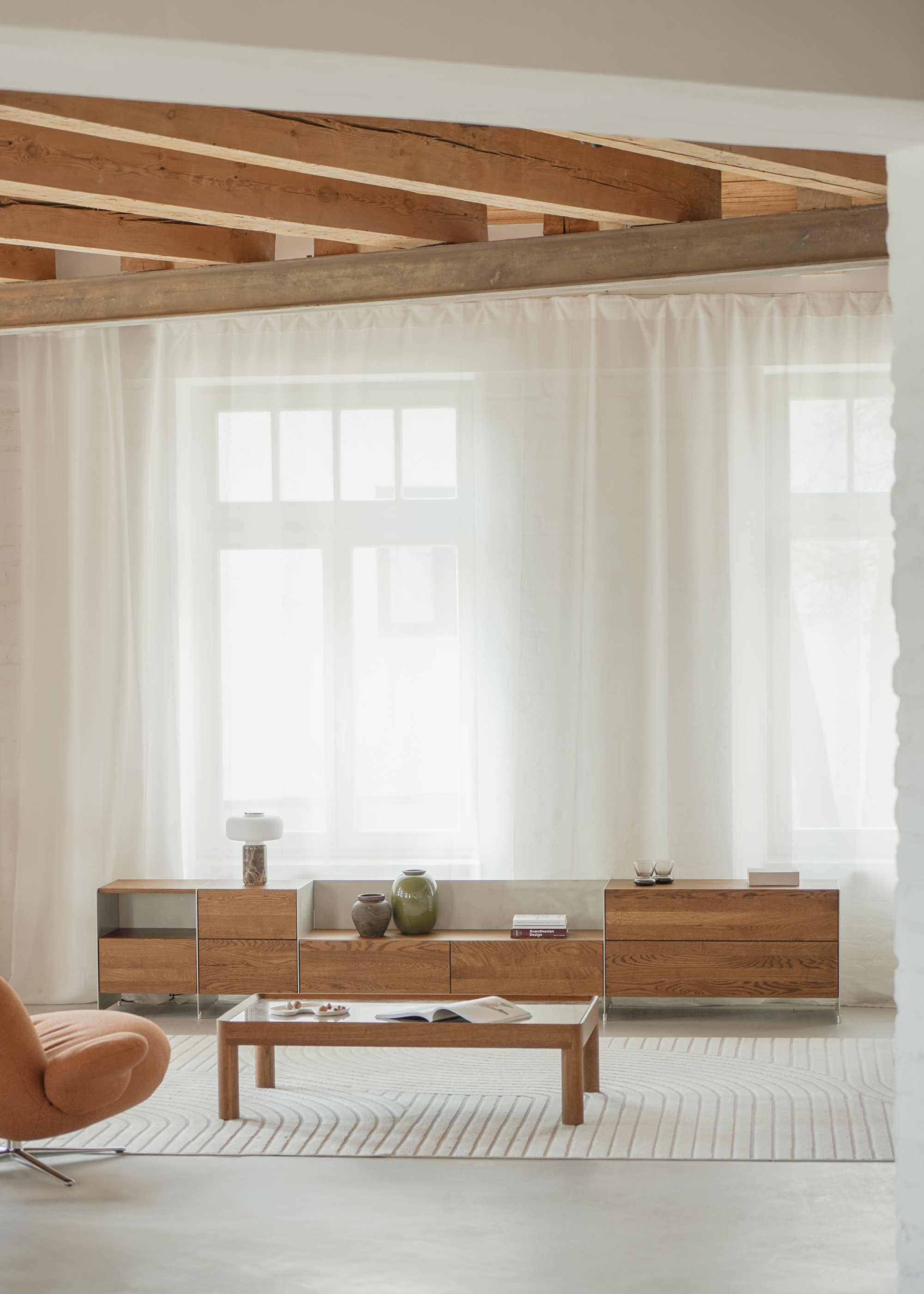 Bright modern living room with designer wooden furniture and contemporary interior decor