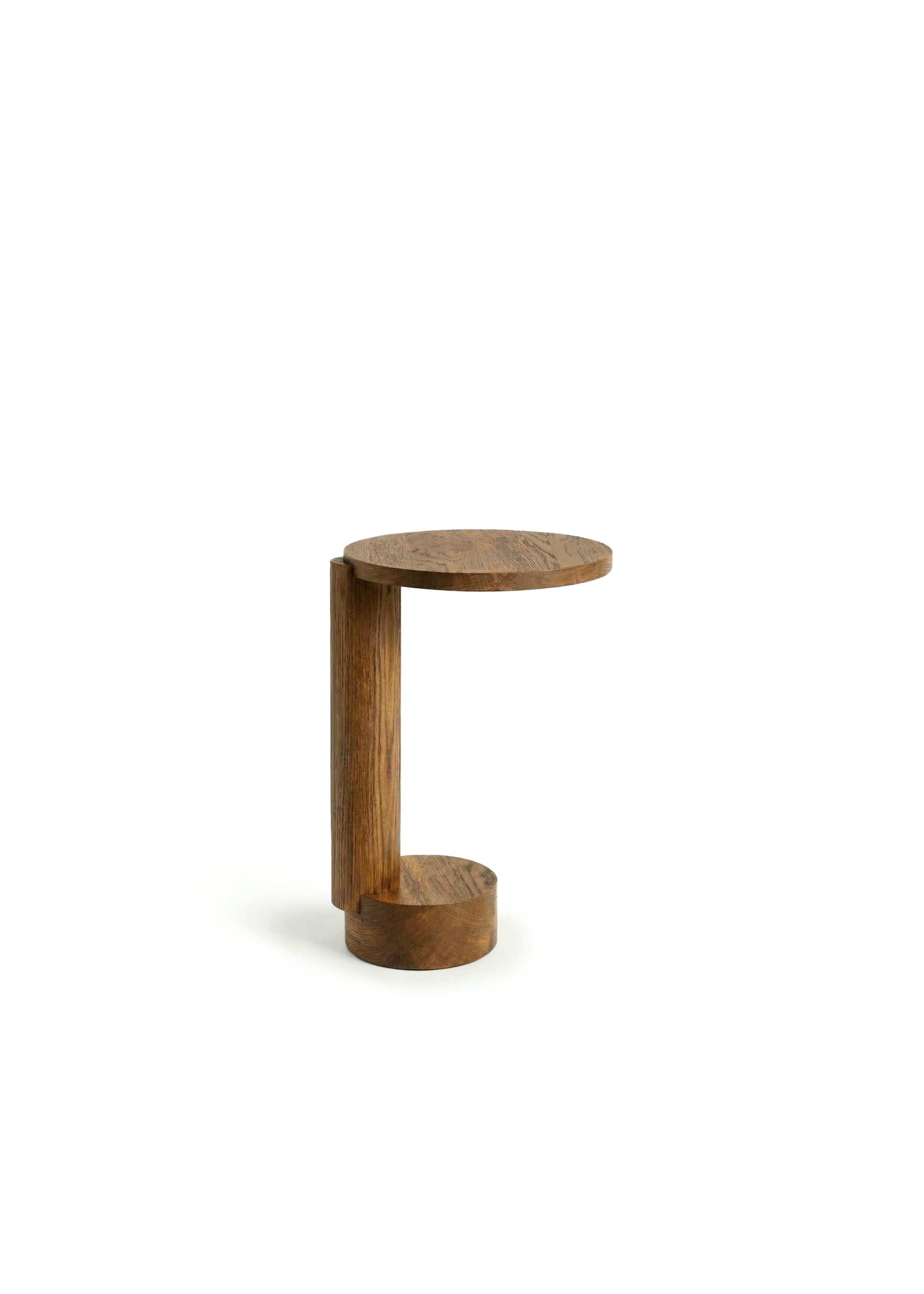 Wooden side table next to a cream sofa with a floor lamp behind it