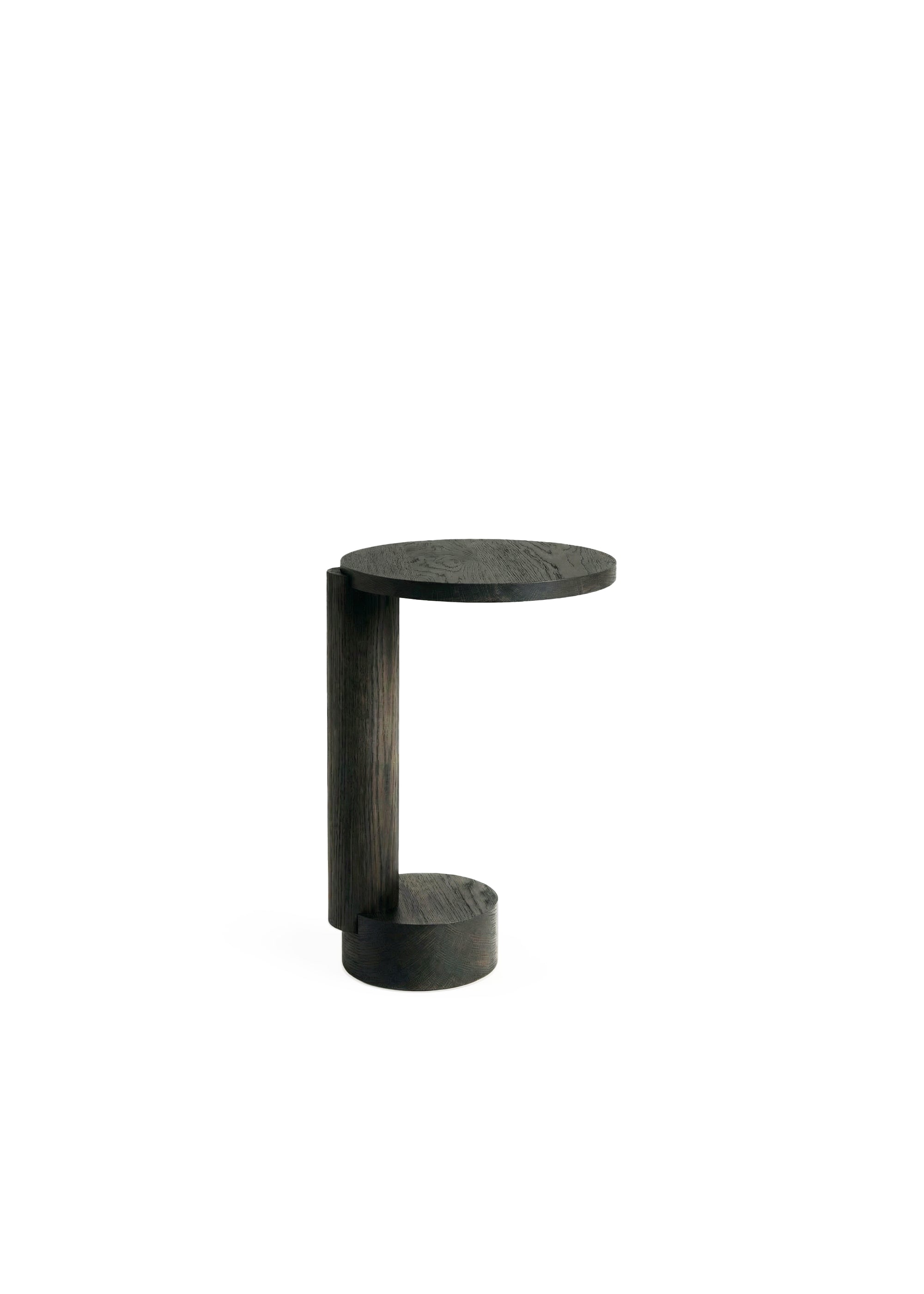 Sculptural side table made of dark wood