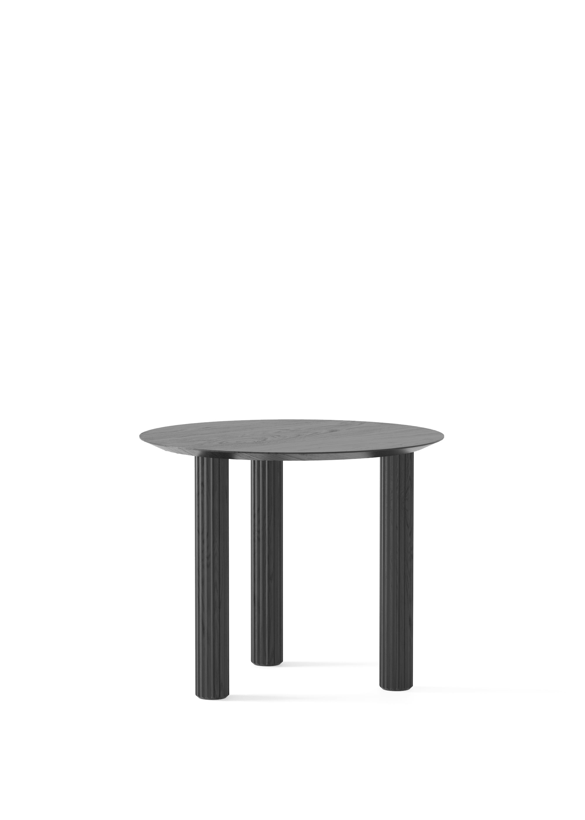 Small round black wooden table with three fluted cylindrical legs