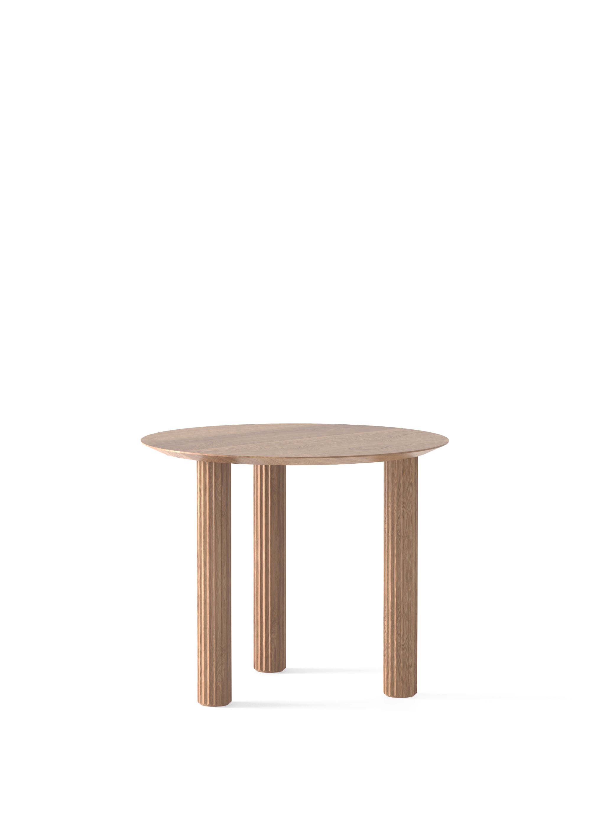 Round light-oak dining table with fluted cylindrical legs, styled with breakfast items and paired with a matching wooden chair.