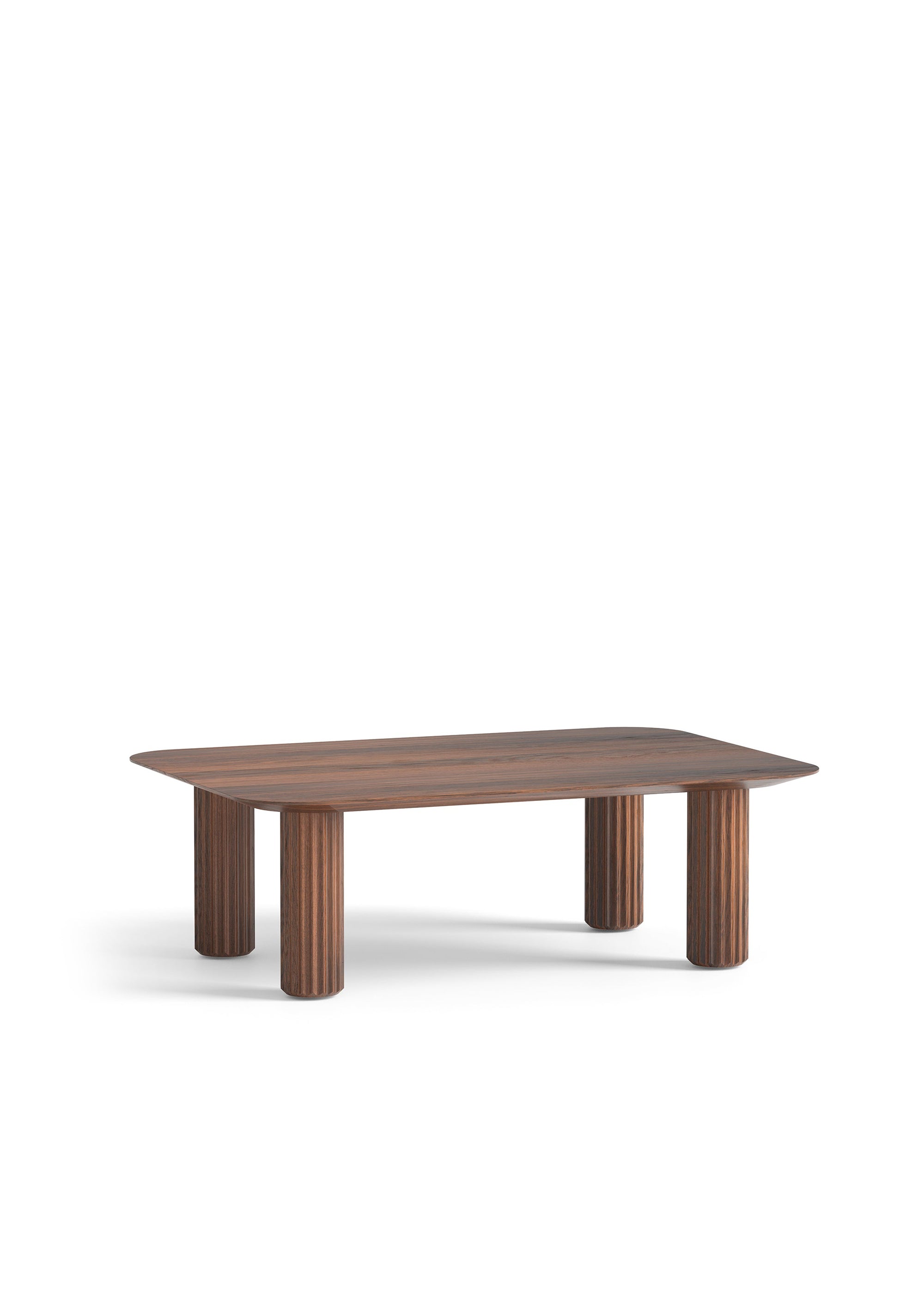 A wooden coffee table with rounded edges and cylindrical legs placed in front of a light grey modular sofa.