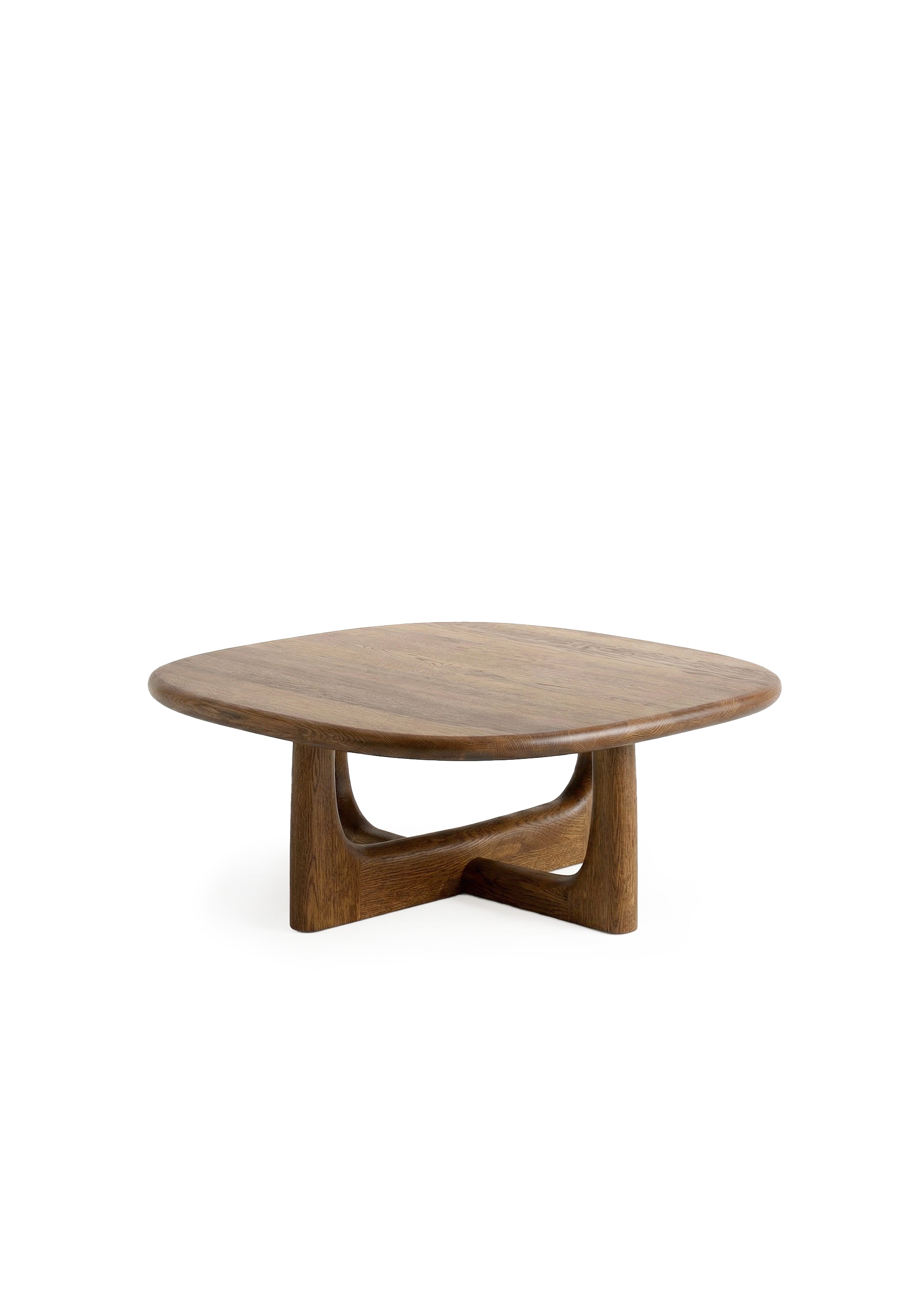 Walnut sculptural coffee table with curved intersecting legs, styled in a neutral interior beside a cream sofa