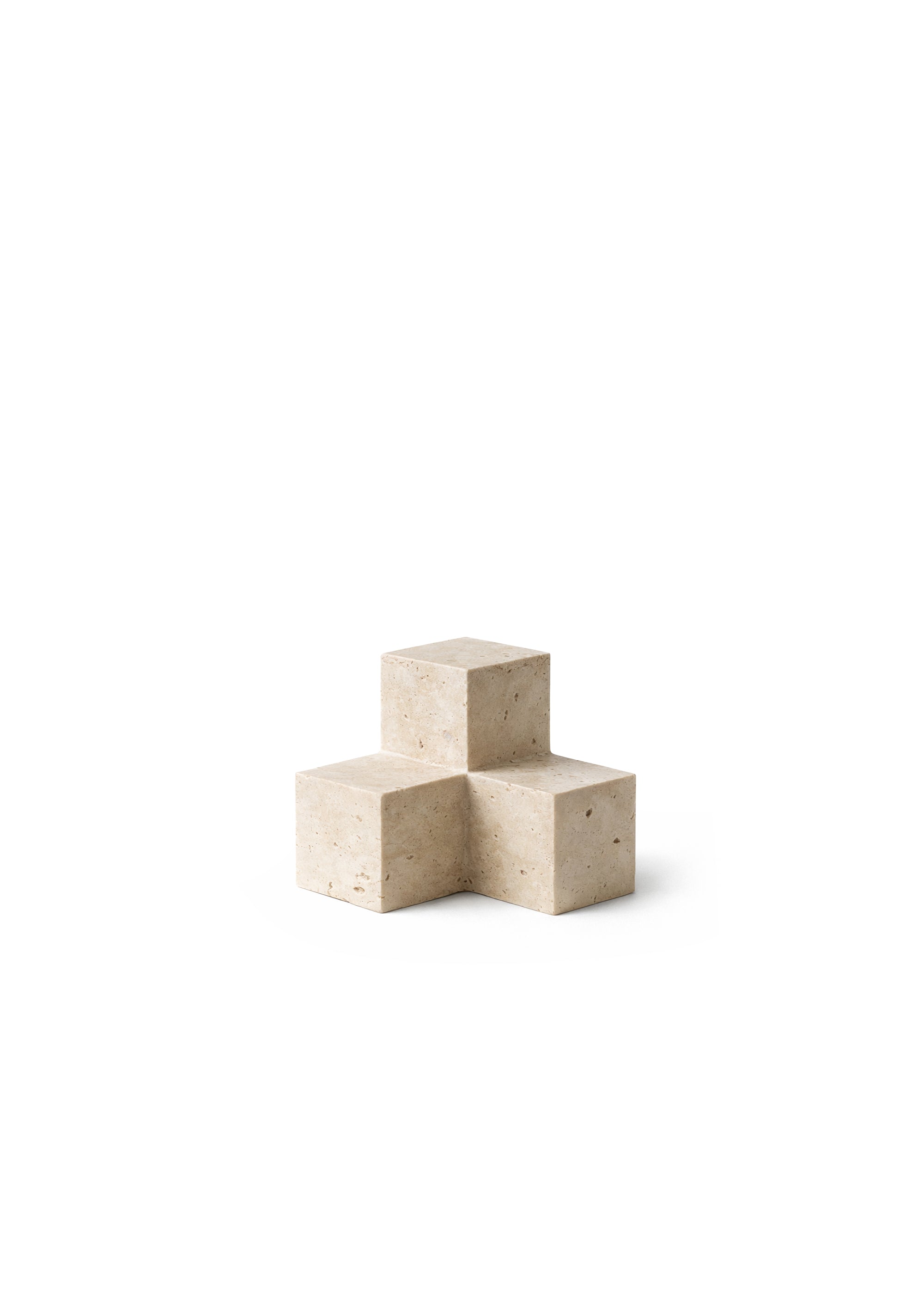 Shelf with wooden surfaces and black metal supports, holding books and a beige stone geometric decorative block